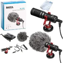 BOYA MM1 compact black microphone with red suspension mount, furry windshield, cables, pouch and retail box in a product collage