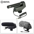 BOYA VM600 black camera microphone with coiled audio cable, shown uncovered and with foam and furry windshields