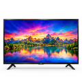 AI-edited TCL TV-only front view on white with illustrative sunset mountain lake screen.